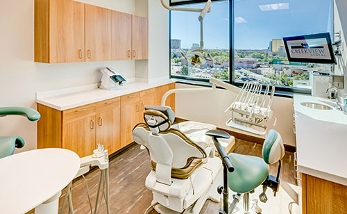 Happy woman smiling in dental chair